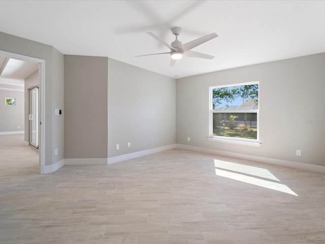 spare room featuring light wood-type flooring and ceiling fan