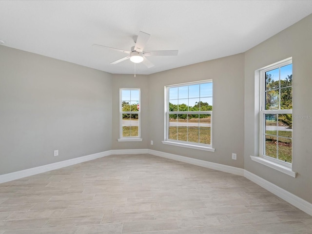 spare room with ceiling fan and light hardwood / wood-style floors