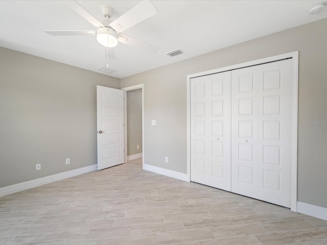 unfurnished bedroom with ceiling fan, light hardwood / wood-style floors, and a closet