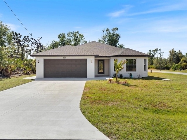 ranch-style house with a garage and a front lawn