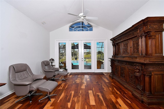 living area with lofted ceiling, dark wood-type flooring, french doors, and ceiling fan