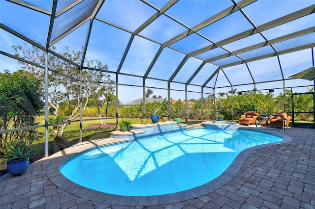 view of pool featuring an in ground hot tub, a patio, and glass enclosure