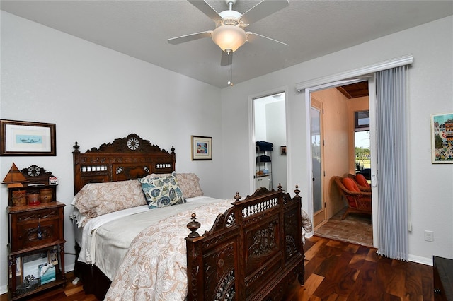 bedroom with dark wood-type flooring and ceiling fan