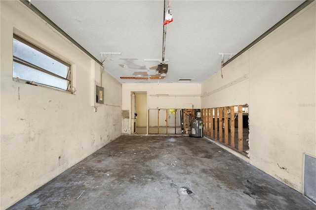 garage featuring a garage door opener and electric panel