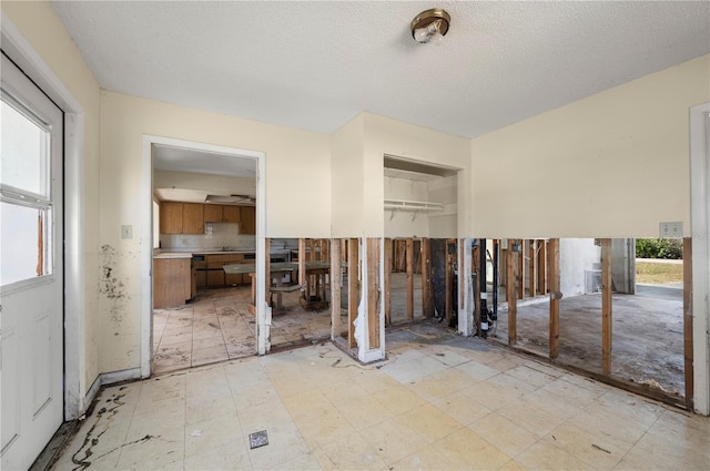 interior space featuring a textured ceiling