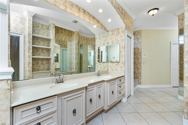 bathroom with tile patterned flooring, ornamental molding, wallpapered walls, and a sink