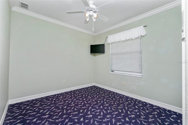 unfurnished room featuring visible vents, baseboards, carpet, and ornamental molding