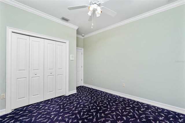 unfurnished bedroom with visible vents, crown molding, baseboards, and carpet floors