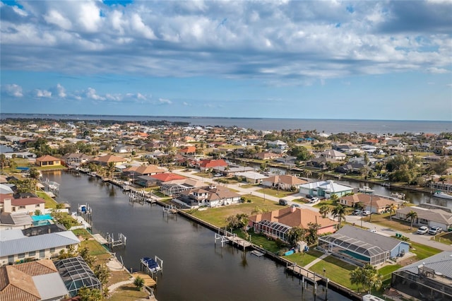 bird's eye view featuring a residential view and a water view