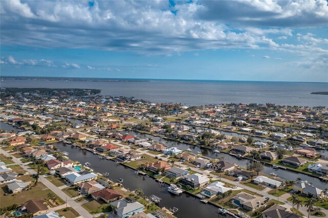 bird's eye view featuring a water view and a residential view