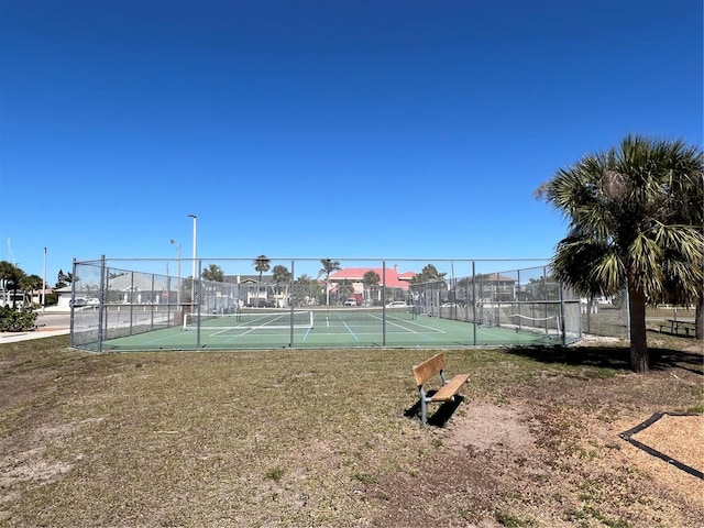 view of tennis court with fence