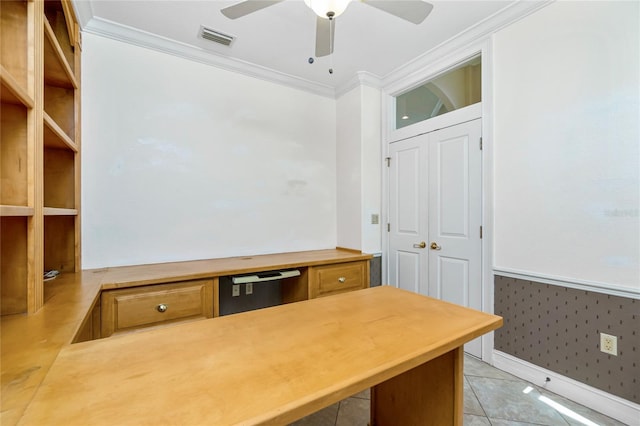 office area featuring a ceiling fan, visible vents, baseboards, light tile patterned flooring, and crown molding