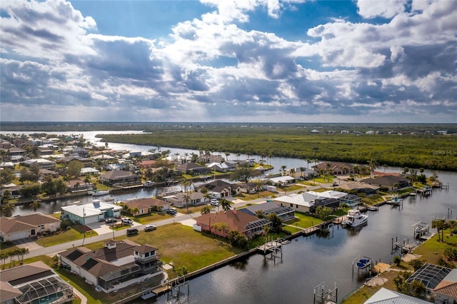 birds eye view of property featuring a residential view and a water view