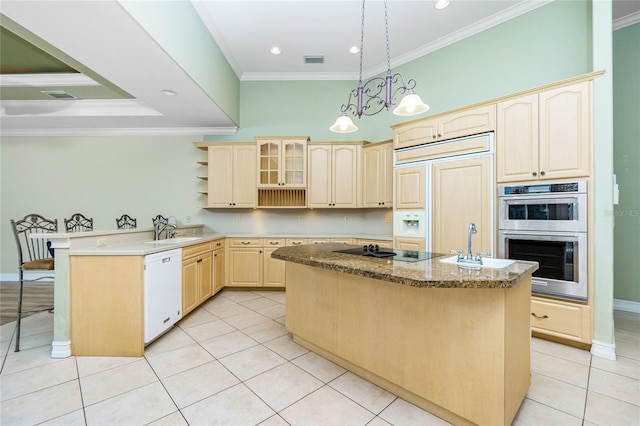 kitchen with paneled built in refrigerator, a peninsula, white dishwasher, double oven, and black electric cooktop