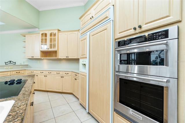 kitchen featuring light tile patterned flooring, crown molding, glass insert cabinets, double oven, and black electric stovetop