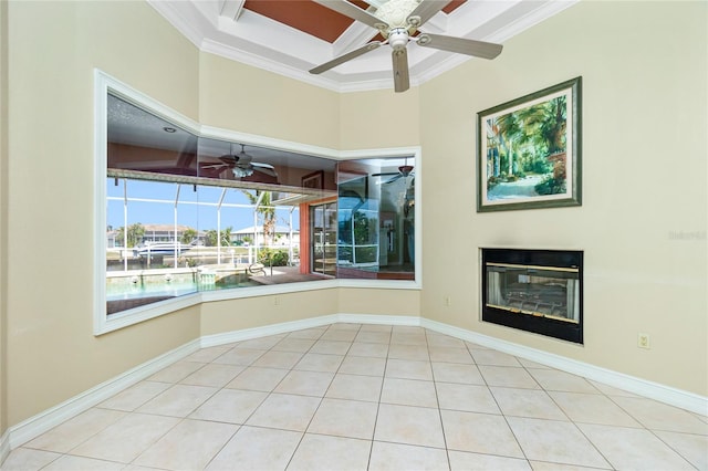 unfurnished living room featuring light tile patterned floors, ceiling fan, crown molding, and a sunroom