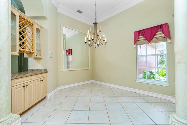 unfurnished dining area featuring a notable chandelier, visible vents, baseboards, and ornamental molding