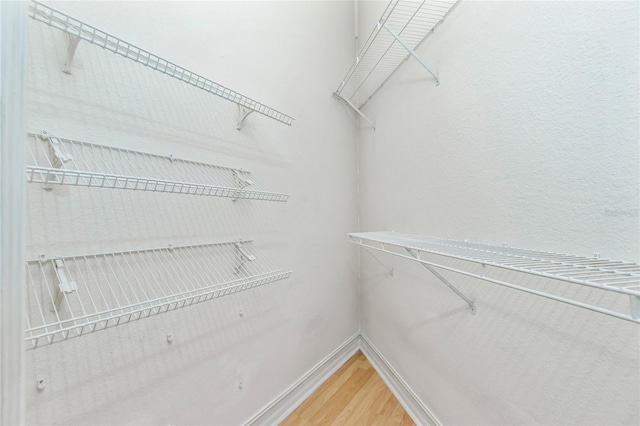 spacious closet with light wood-style floors