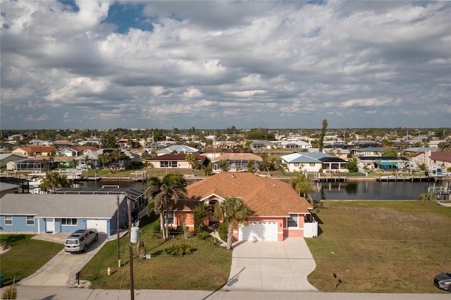 bird's eye view featuring a residential view and a water view