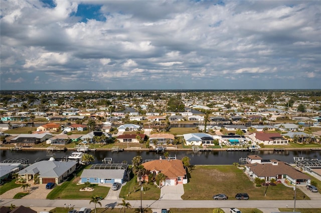 aerial view with a residential view and a water view