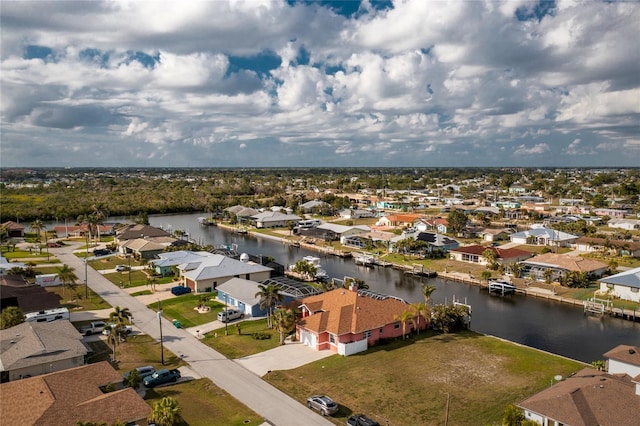 aerial view featuring a residential view and a water view