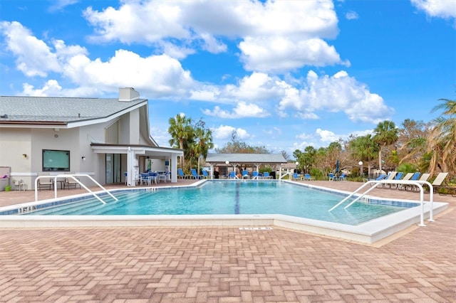 view of swimming pool featuring a patio area