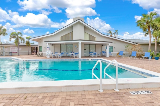 view of swimming pool featuring a patio