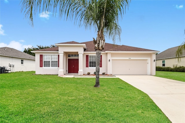 view of front of home featuring a garage and a front lawn