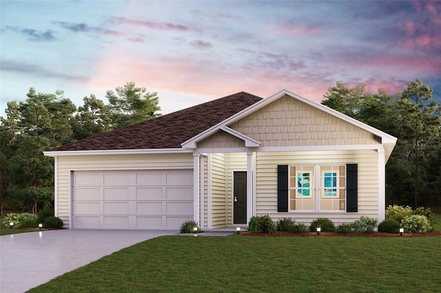 view of front of house featuring a yard and a garage