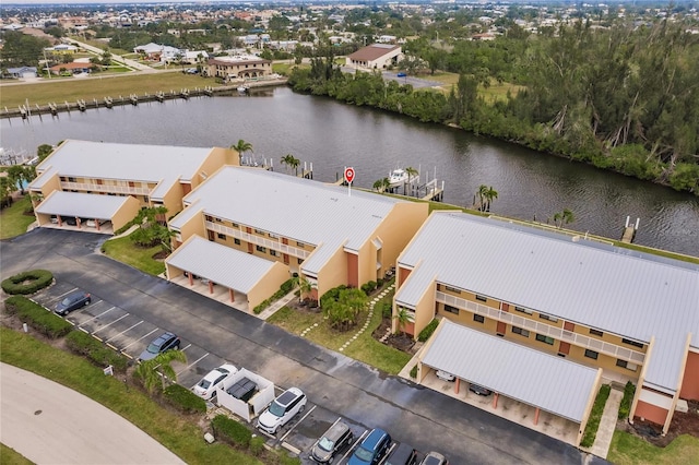 birds eye view of property with a water view