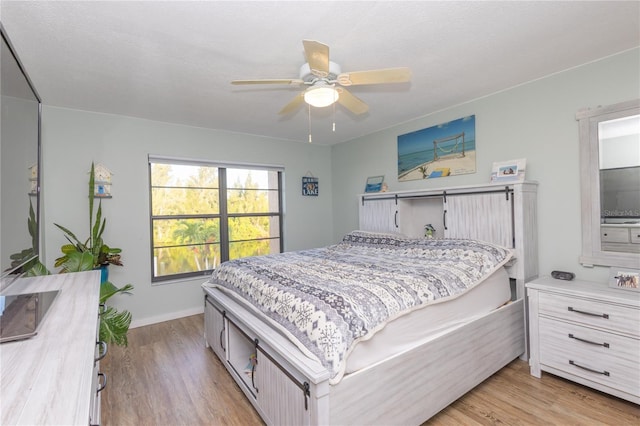 bedroom with light wood-type flooring and ceiling fan