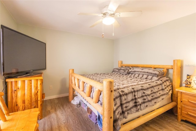 bedroom with hardwood / wood-style flooring and ceiling fan