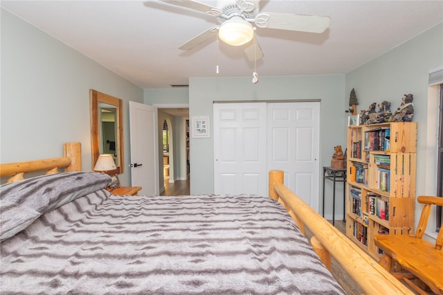 bedroom featuring ceiling fan and a closet