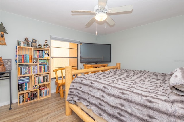 bedroom featuring wood-type flooring and ceiling fan