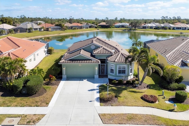 birds eye view of property with a water view