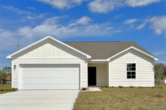 single story home featuring driveway, roof with shingles, an attached garage, board and batten siding, and a front yard