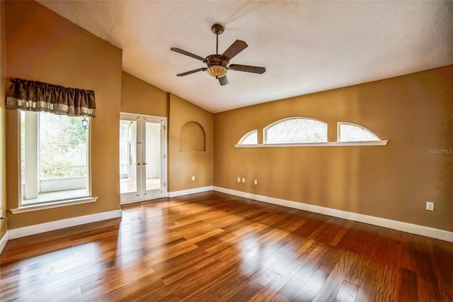 spare room with french doors, ceiling fan, lofted ceiling, and hardwood / wood-style floors