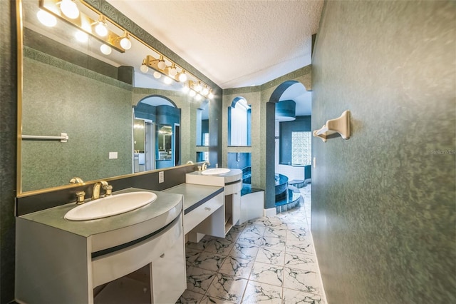 bathroom featuring vanity and a textured ceiling