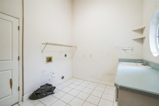 clothes washing area with washer hookup, hookup for an electric dryer, sink, and light tile patterned floors