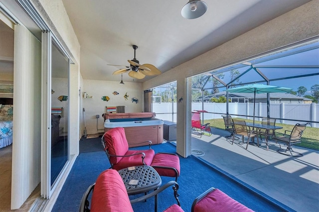 sunroom / solarium with ceiling fan