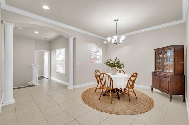 dining room featuring ornamental molding, decorative columns, and light tile patterned floors