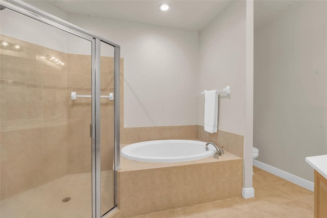 full bathroom featuring vanity, tile patterned floors, toilet, and separate shower and tub