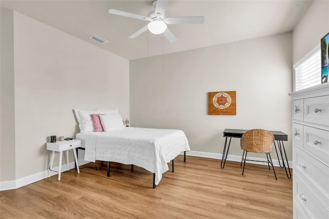 bedroom with ceiling fan and light wood-type flooring