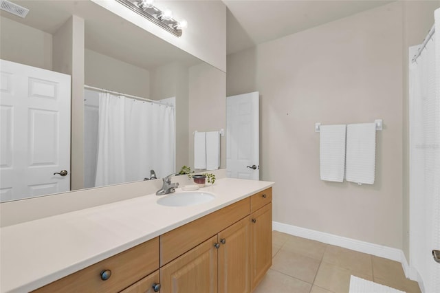 bathroom with vanity and tile patterned floors