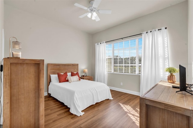 bedroom with hardwood / wood-style flooring and ceiling fan