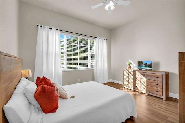 bedroom featuring hardwood / wood-style floors and ceiling fan