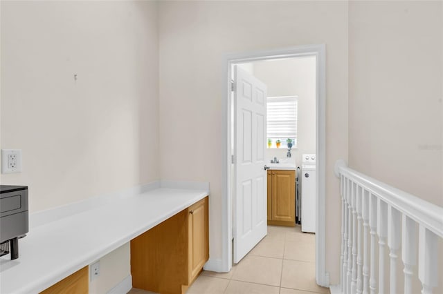 hall featuring light tile patterned floors