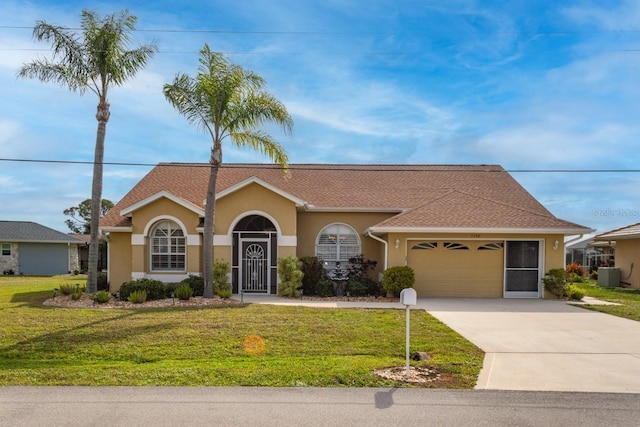 view of front of house featuring an attached garage, a front yard, and stucco siding