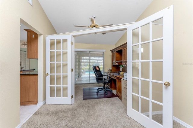 home office with vaulted ceiling, light colored carpet, french doors, and ceiling fan