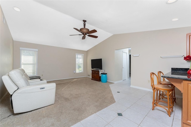 living room with light carpet, lofted ceiling, and ceiling fan